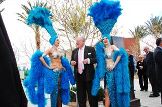 Former Las Vegas Mayor Oscar Goodman, accompanied by his famous showgirls, awaits the unveiling of a bronze bust in his likeness at Symphony Park, Monday March, 12 2012.